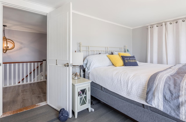 116 Hills Beach Rd, Biddeford, ME 04005 - bedroom featuring ornamental molding, wood finished floors, and a chandelier