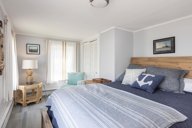 116 Hills Beach Rd, Biddeford, ME 04005 - bedroom with baseboard heating, carpet flooring, crown molding, and a closet