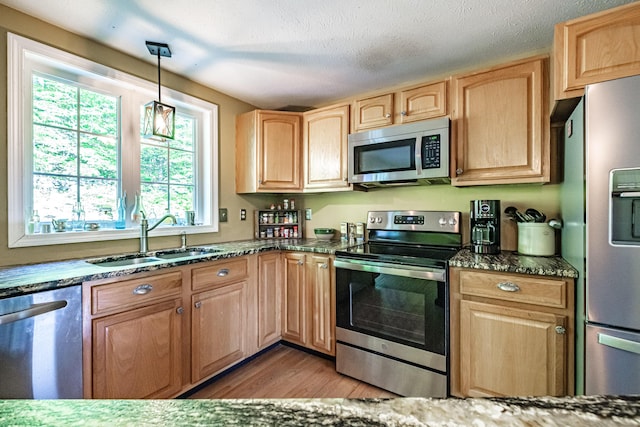 739 Spec Pond Rd, Porter, ME 04068 - kitchen with appliances with stainless steel finishes, a sink, plenty of natural light, and light brown cabinets
