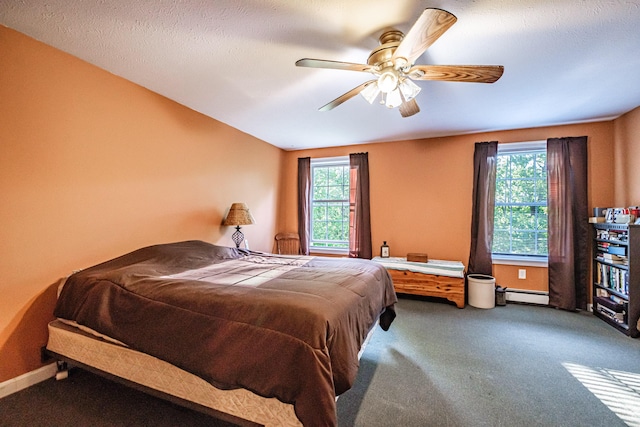 739 Spec Pond Rd, Porter, ME 04068 - carpeted bedroom with baseboard heating, multiple windows, ceiling fan, and baseboards