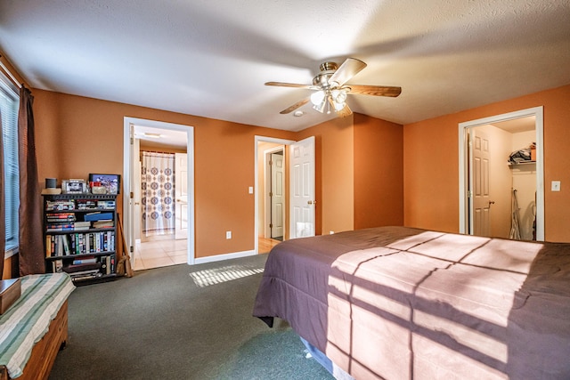 739 Spec Pond Rd, Porter, ME 04068 - bedroom featuring carpet floors, ensuite bathroom, baseboards, and a ceiling fan