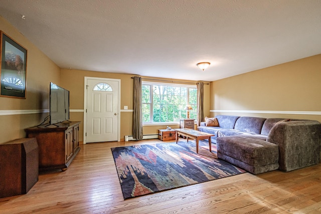 739 Spec Pond Rd, Porter, ME 04068 - living room featuring light wood-style floors and baseboard heating