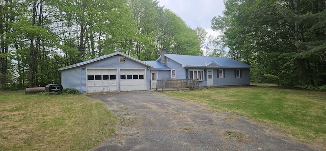 2042 Athens Rd, Hartland, ME 04943 - ranch-style home with a chimney, a front yard, metal roof, and asphalt driveway