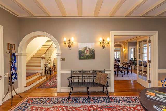18 Bayside Dr, Belfast, ME 04915 - living room featuring wood finished floors, stairs, and arched walkways