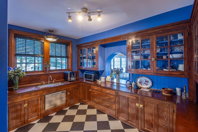 18 Bayside Dr, Belfast, ME 04915 - kitchen featuring dark floors, dark countertops, dishwasher, and glass insert cabinets