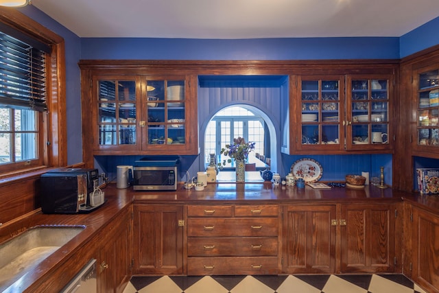 18 Bayside Dr, Belfast, ME 04915 - kitchen with stainless steel microwave, glass insert cabinets, and dark countertops