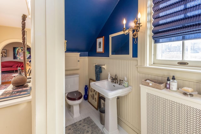 18 Bayside Dr, Belfast, ME 04915 - bathroom featuring wainscoting, vaulted ceiling, and tile patterned flooring