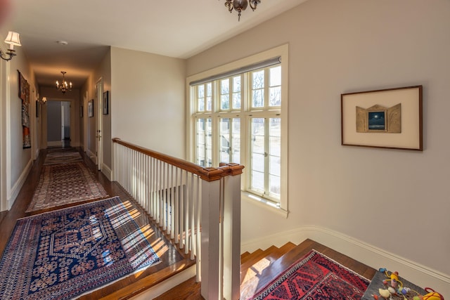 18 Bayside Dr, Belfast, ME 04915 - corridor with a chandelier, wood finished floors, and an upstairs landing