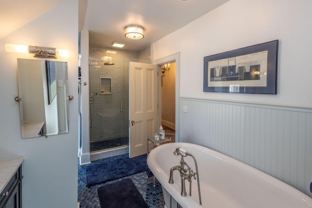 18 Bayside Dr, Belfast, ME 04915 - bathroom featuring a stall shower, a soaking tub, vanity, and a wainscoted wall