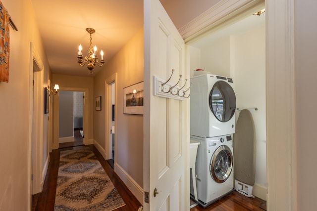 18 Bayside Dr, Belfast, ME 04915 - laundry room featuring stacked washer / drying machine, a chandelier, dark wood-type flooring, and radiator