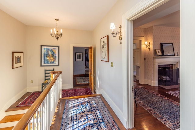18 Bayside Dr, Belfast, ME 04915 - hall featuring dark wood-type flooring and a chandelier