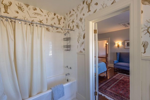 18 Bayside Dr, Belfast, ME 04915 - ensuite bathroom featuring wallpapered walls, shower / tub combo with curtain, and wood finished floors