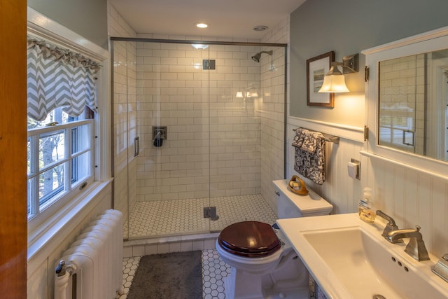 18 Bayside Dr, Belfast, ME 04915 - full bathroom with radiator, a stall shower, a wainscoted wall, and tile patterned floors