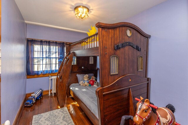 18 Bayside Dr, Belfast, ME 04915 - bedroom with wood finished floors and radiator heating unit