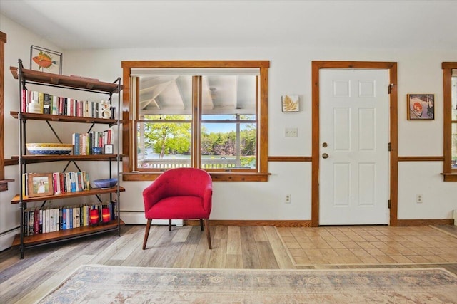 51 Four Wheel Dr, Brunswick, ME 04011 - sitting room featuring baseboard heating and wood finished floors