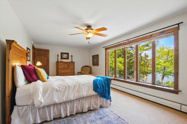 51 Four Wheel Dr, Brunswick, ME 04011 - bedroom featuring a baseboard heating unit, multiple windows, and a ceiling fan