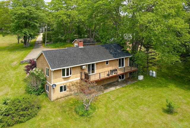 56 Borland Hill Rd, Nobleboro, ME 04555 - back of house featuring a shingled roof, a lawn, a wooden deck, and view of scattered trees
