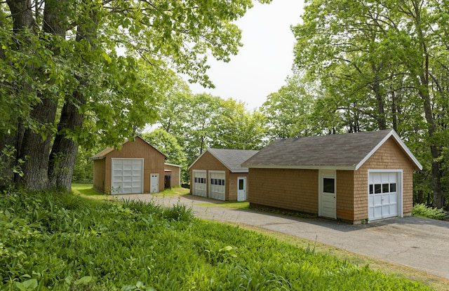 56 Borland Hill Rd, Nobleboro, ME 04555 - ranch-style house with roof with shingles, a detached garage, and an outbuilding