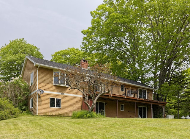 56 Borland Hill Rd, Nobleboro, ME 04555 - back of house featuring a wooden deck, a yard, and a chimney