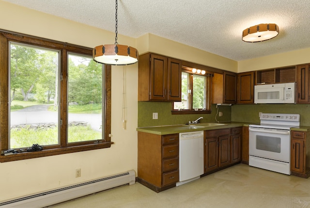 56 Borland Hill Rd, Nobleboro, ME 04555 - kitchen featuring white appliances, a baseboard radiator, a textured ceiling, decorative light fixtures, and brown cabinets