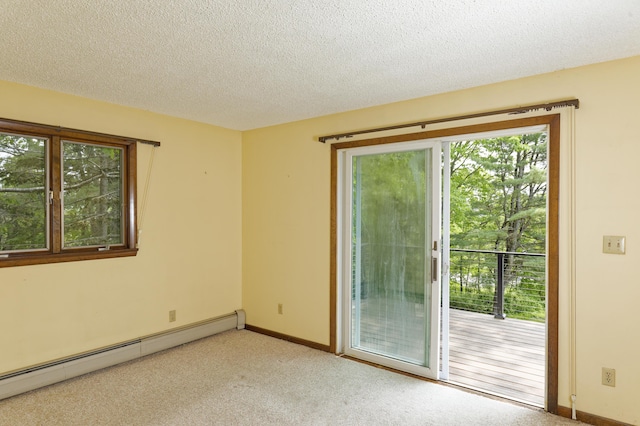 56 Borland Hill Rd, Nobleboro, ME 04555 - spare room featuring baseboard heating, light colored carpet, and a textured ceiling