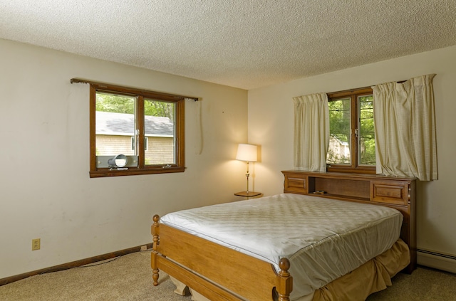 56 Borland Hill Rd, Nobleboro, ME 04555 - carpeted bedroom featuring multiple windows, a textured ceiling, and baseboard heating