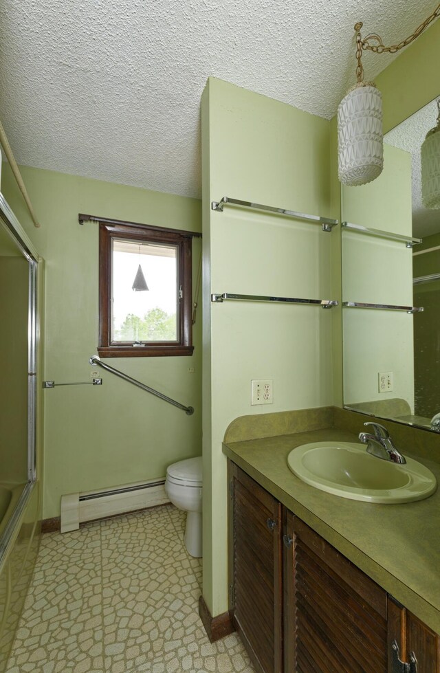 56 Borland Hill Rd, Nobleboro, ME 04555 - bathroom featuring a baseboard heating unit, vanity, a textured ceiling, and shower / bath combination with glass door