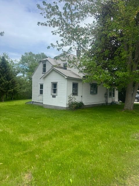 179 Raymond St, Pittsfield, ME 04967 - back of house with a chimney and a yard