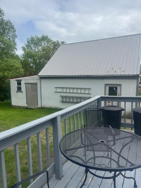 179 Raymond St, Pittsfield, ME 04967 - wooden terrace featuring outdoor dining area and a yard