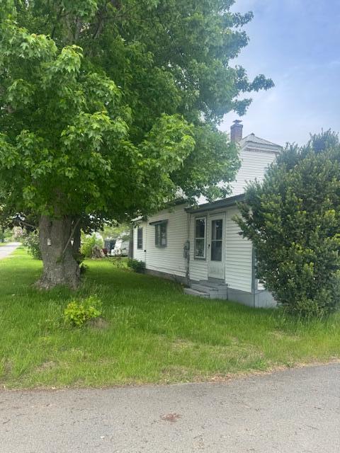 179 Raymond St, Pittsfield, ME 04967 - view of side of property featuring a chimney and entry steps