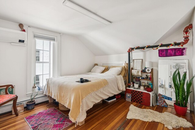 148 State St, Portland, ME 04101 - bedroom featuring vaulted ceiling, wood finished floors, and a wall unit AC