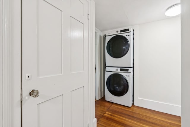 148 State St, Portland, ME 04101 - laundry room featuring stacked washer / drying machine and wood finished floors