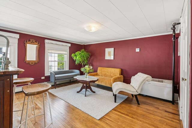 148 State St, Portland, ME 04101 - living area with crown molding and light wood-style flooring