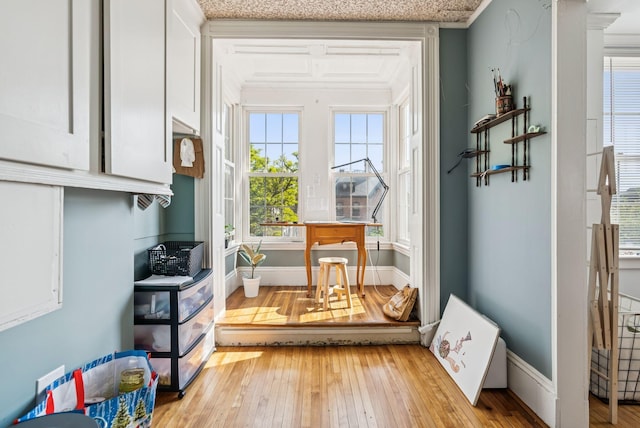 148 State St, Portland, ME 04101 - doorway to outside featuring light wood-type flooring, ornamental molding, and baseboards