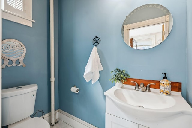 148 State St, Portland, ME 04101 - bathroom with toilet, vanity, and baseboards