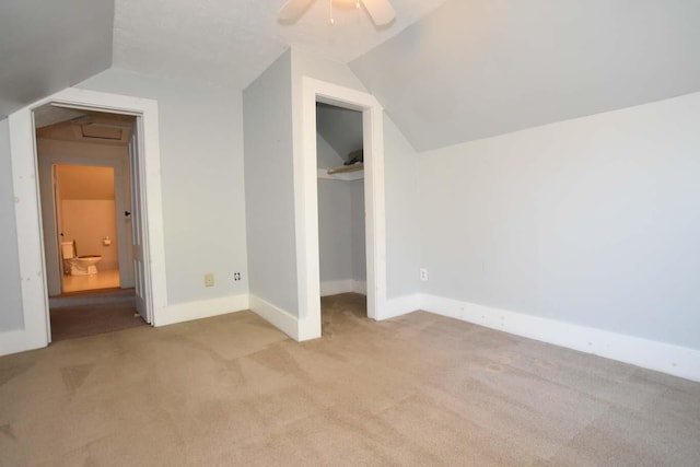 50 Baldwin Rd, Sebago, ME 04029 - unfurnished bedroom featuring vaulted ceiling, carpet, a closet, baseboards, and ceiling fan