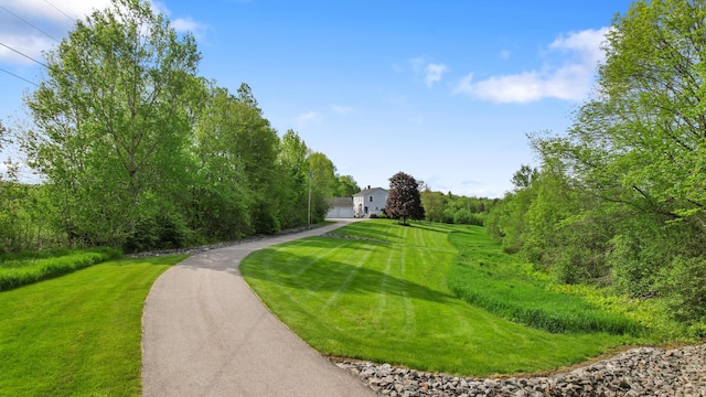 216 Monroe Rd, Winterport, ME 04496 - surrounding community with driveway and a lawn