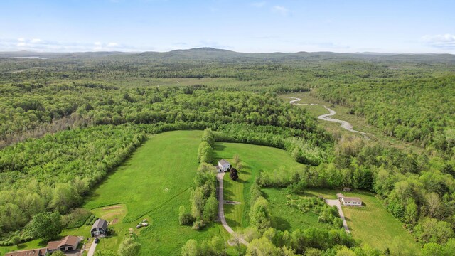 216 Monroe Rd, Winterport, ME 04496 - bird's eye view of a heavily wooded area and a mountain backdrop