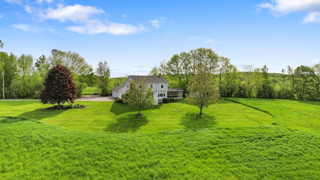 216 Monroe Rd, Winterport, ME 04496 - view of grassy yard featuring driveway and an attached garage