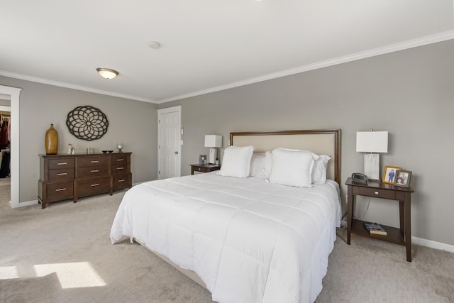 216 Monroe Rd, Winterport, ME 04496 - bedroom featuring light colored carpet, crown molding, baseboards, and a walk in closet