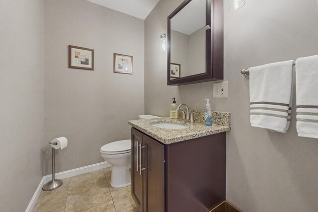 216 Monroe Rd, Winterport, ME 04496 - half bath with baseboards, toilet, vanity, and tile patterned flooring