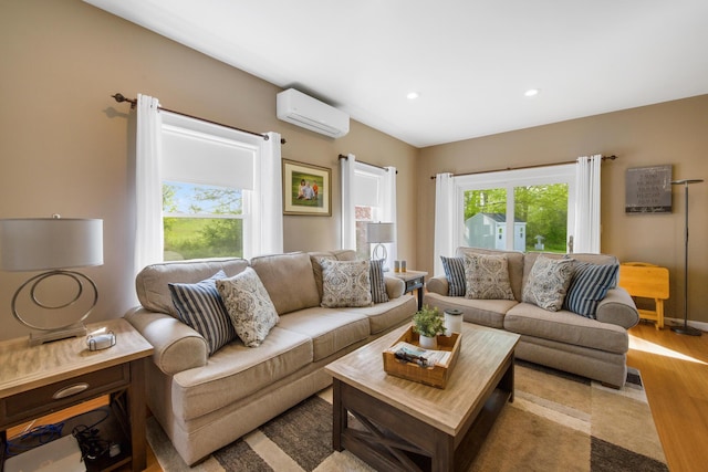 216 Monroe Rd, Winterport, ME 04496 - living area with a wall mounted AC, wood finished floors, and recessed lighting