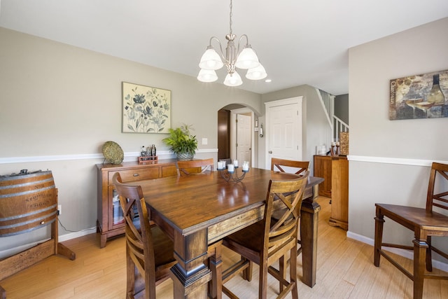 216 Monroe Rd, Winterport, ME 04496 - dining space featuring arched walkways, a chandelier, light wood-style floors, baseboards, and recessed lighting