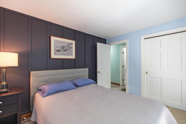 183 Buckfield Rd, Turner, ME 04282 - bedroom with light colored carpet and a decorative wall