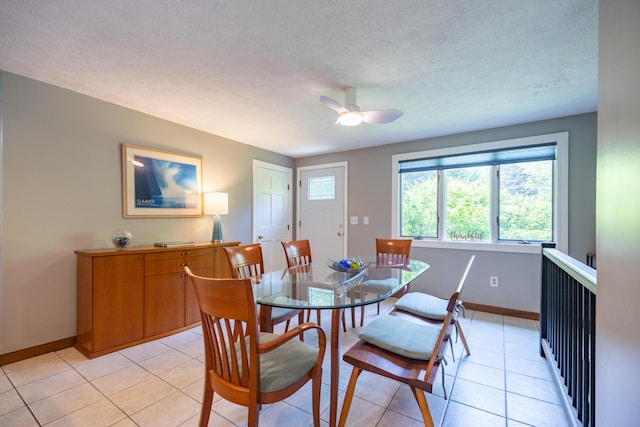 183 Buckfield Rd, Turner, ME 04282 - dining space with light tile patterned floors, baseboards, a ceiling fan, and a textured ceiling
