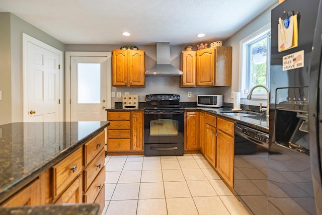 183 Buckfield Rd, Turner, ME 04282 - kitchen featuring wall chimney exhaust hood, black appliances, a sink, dark stone countertops, and brown cabinets