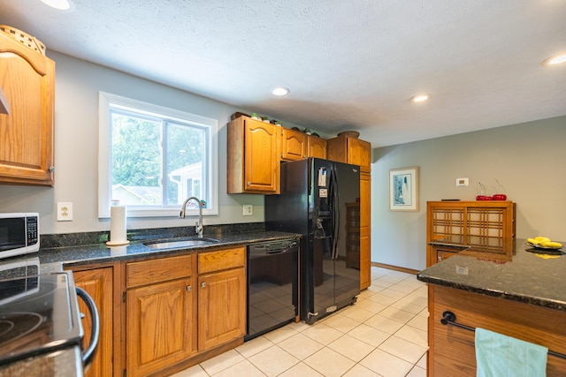 183 Buckfield Rd, Turner, ME 04282 - kitchen with black appliances, a sink, brown cabinets, recessed lighting, and dark stone counters