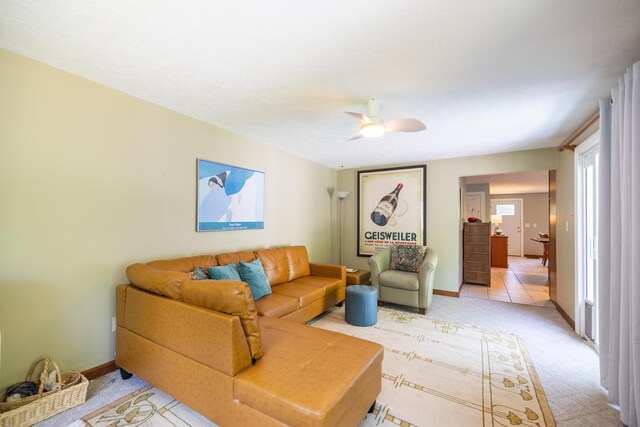 183 Buckfield Rd, Turner, ME 04282 - living area featuring a ceiling fan, light carpet, and baseboards
