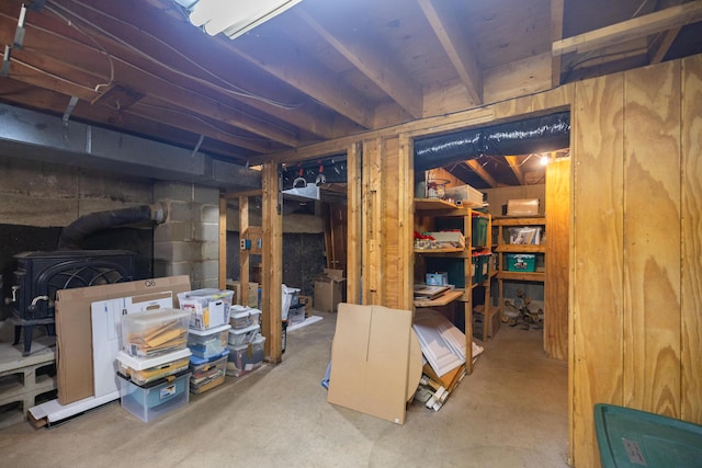 183 Buckfield Rd, Turner, ME 04282 - unfinished basement featuring a wood stove