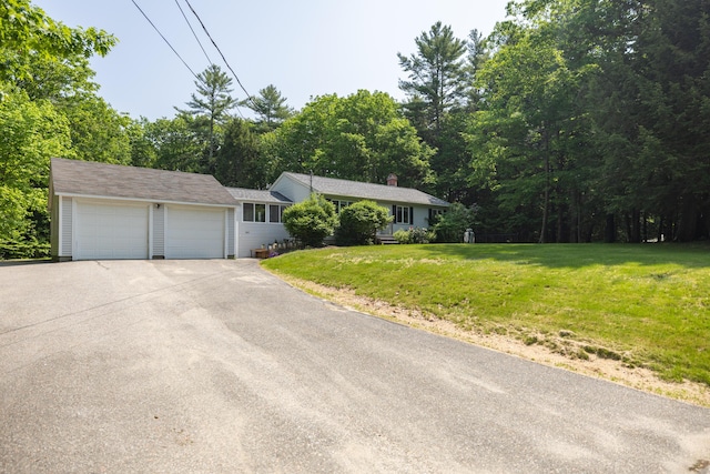 183 Buckfield Rd, Turner, ME 04282 - ranch-style house featuring a garage, a front lawn, asphalt driveway, and a view of trees